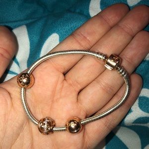 PANDORA BRACELET WITH 3 CHARMS.